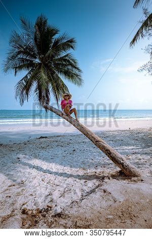 Wua Laen Beach Chumphon Area Thailand, Palm Tree Hanging Over The Beach With Girl On Vacation In Tha