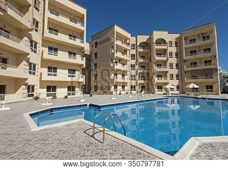Large Swimming Pool With At A Luxury Tropical Apartment Resort Complex