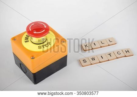 An Industrial Emergency Stop Button With A Sign Reading Kill Switch