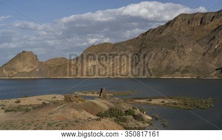 Damghan, Iran - May 24, 2019: Lake Near Damghan With Mountains At Sunset, Iran.