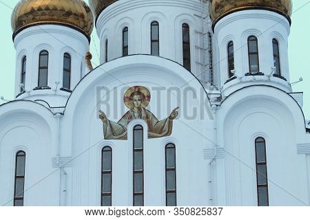 Picturesque Painting Of An Angel On A White Wall Of An Orthodox Church. Stock Photo For Web And Prin