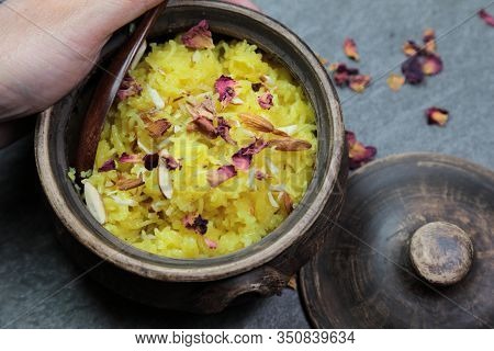 Sweet Rice Or Zarda Pulao On A Grey Background With Copy Space.