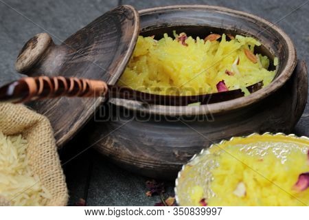 Sweet Rice Or Zarda Pulao On A Grey Background With Copy Space.