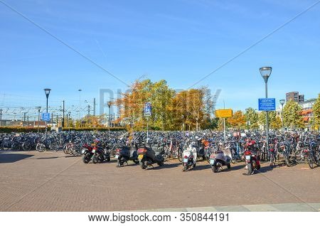Venlo, Limburg, Netherlands - October 13, 2018: Rows Of Parked Bicycles And Motorcycles In The Dutch
