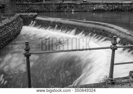 Black And White Photo Of A Waterfall In Cheddar Village In Somerset