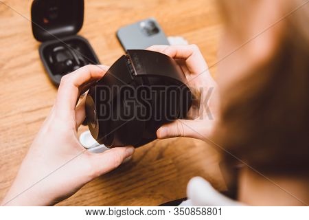 Paris, France - Oct 30, 2019: Overhead View Of Woman Hands Unfolding Beats Pro Headphones With Activ