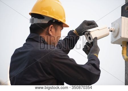 Cctv Technicians Install, Maintain Ip Surveillance Cameras Outdoors For Workplace Safety.