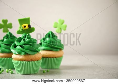 Delicious Decorated Cupcakes On Light Table, Space For Text. St. Patrick's Day Celebration