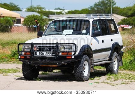 Maun, Botswana - February 10, 2020: Off-road Car Toyota Land Cruiser 80 In The Town Street.