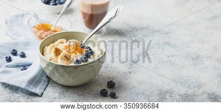 Breakfast With Milk Rice Porridge With Banans, Blueberry And Orange Jam, Creamy Rice Pudding Or Fren