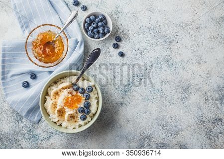 Breakfast With Milk Rice Porridge With Banans, Blueberry And Orange Jam, Creamy Rice Pudding Or Fren