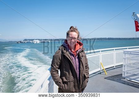 Smiling Young Woman On Ferry Vancouver To Swartz Bay, Vancouver Island British Columbia Canada