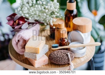 Set Of Natural Eco-friendly Bath Accessories On Wooden Table. Top View Shower And Bath Sponge, Luffa