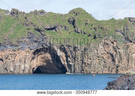 Hole In The Cliff On Island Of Heimaey In Vestmannaeyjar Of The South Coast Of Iceland