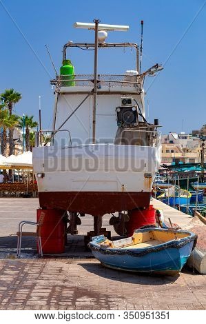 Multicolored Fishing Boats Luzzu With Eyes In The Harbor. Marsaxlokk. Malta.