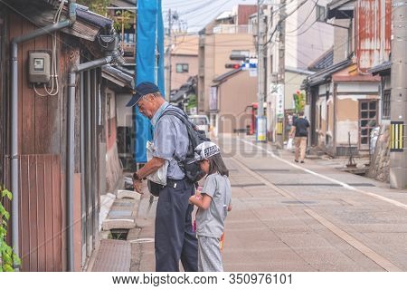 Tourists Are Walking In The Old Nishi Chaya District.