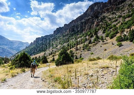 Turkey, Chamard - August 3, 2019: Tourist Walk Along The Road Through The Mountain Landscape In The 