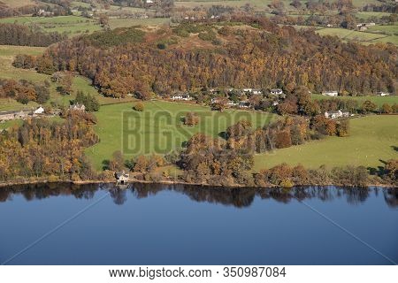Epic Autumn Fall Landscape Of Ullswater And Surrounding Mountains And Hills Viewed From Hallin Fell 