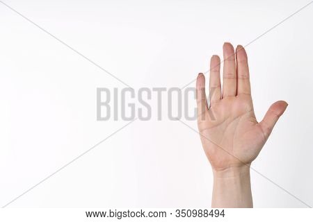 Female Hand Extended In Greeting Isolated On White. Number Five