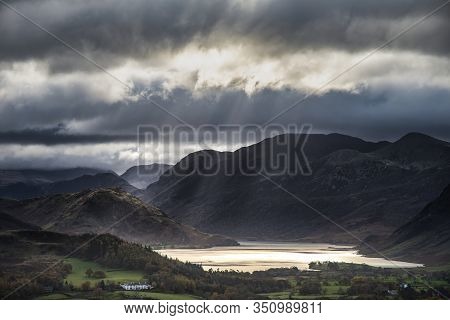Epic Sun Beams Light Up Crummock Water In Dramatic Autumn Fall Landscape Image With Mellbreak And Gr