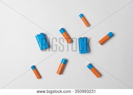 Aa And Pp3 Batteries. Group Of Batteries On White Background. Top View.