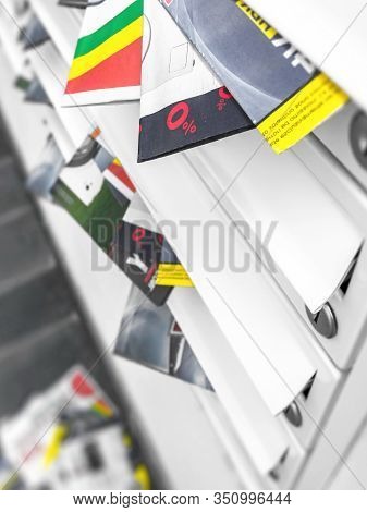 Metal Mail Boxes, Overfull Of Leaflets; Some Have Fallen On The Ground. Ideal For Concepts. Shallow 