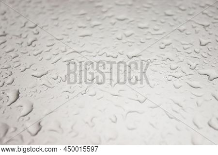 Leaves On The Hood Of A Car In Autumn In Raindrops
