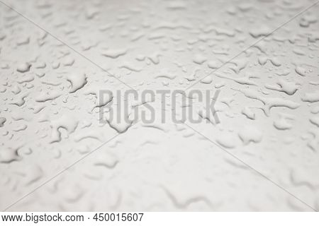 Leaves On The Hood Of A Car In Autumn In Raindrops