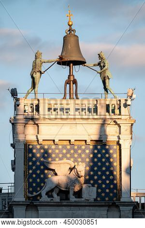 Saint Mark's Clocktower Or Torre Dell'orologio In Venice, Italy With Moors Striking The Hour On A Be
