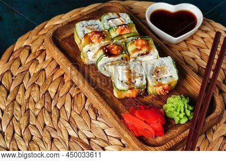 Japanese Rolls With Shrimp Wrapped In Cucumber, Sauce Sushi Copy Space