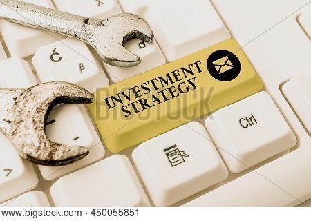 Hand Writing Sign Investment Strategy. Word For What Guides An Investor Decision Based On Goals Risk
