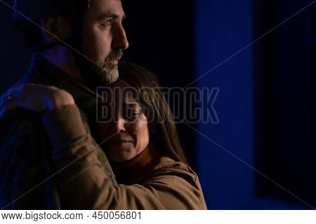 Sad Woman Crying When Hugging Her Military Husband And Saying-goodby To Him.
