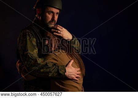 Sad Woman Hugging Her Military Husband And Saying-goodby To Him Before Going To Army On Black Backgo