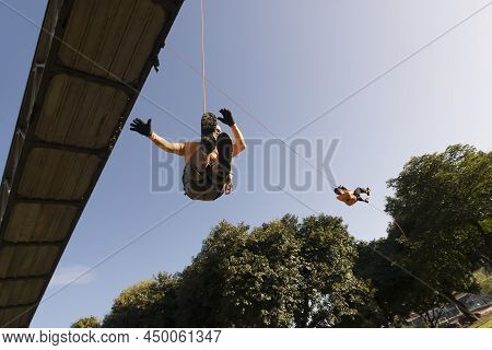 Rappel Practitioner Doing Extreme And Dangerous Marbalisms.