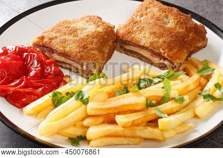 Typical Spanish Gastronomy Cachopo De Ternera Closeup In The White Plate On The Table. Horizontal