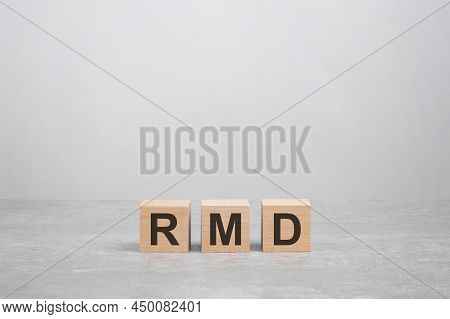 Three Wooden Blocks With The Letters Rmd On The Bright Gray Table. Business Concept. Rmd - Short For