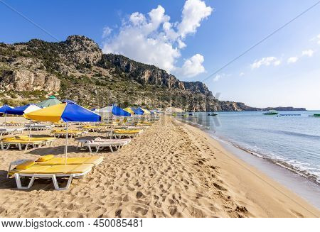 Sunbeds And Umbrellas On Tsampika Beach, Rhodes Island, Greece