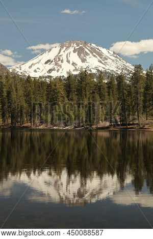 Lassen Peak With Snow Viewed From Reflection Lake In Lassen Volcanic National Park, California