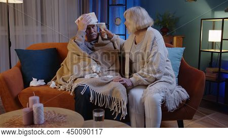 Senior Couple Grandfather And Grandmother Isolated At Home During Covid-19 Coronavirus Quarantine Lo
