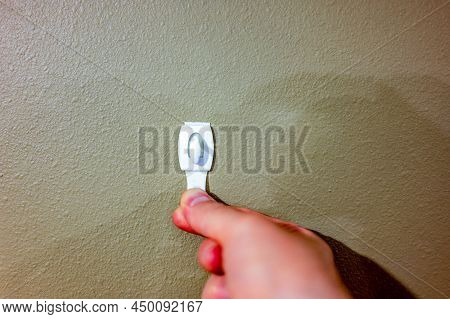 Selective Focus On Adhesive Strip Wall Hanger That Can Be Removed By Pulling Tape