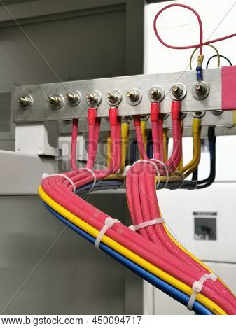 Selective focus image with noise effect three phase single core cables connection in low voltage swi