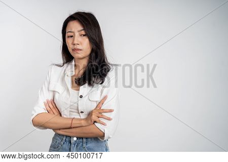 Sad Portrait Of Young Asian Woman Over Isolated Background