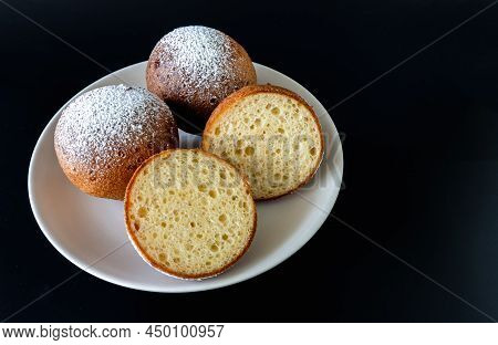Top View Of A Plate Of Lithuanian Large Cones On A Black Background