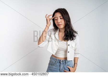Sad Portrait Of Young Asian Woman Over Isolated Background