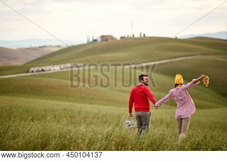 Lovely couple enjoying a beautiful day outisde on meadow