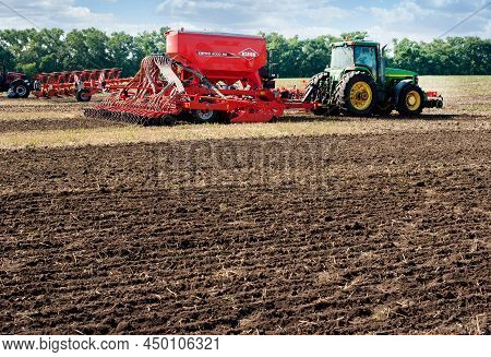 Bilogirya, Khmelnytsky Region, Ukraine - August 19, 2021: Tractor With Seeder Kuhn Espro 6000Rc With