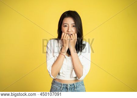 Sad Portrait Of Young Asian Woman Over Isolated Background
