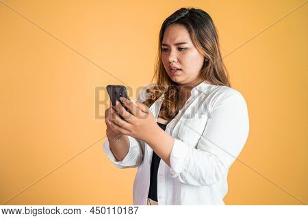 Sad Portrait Of Young Asian Woman Over Isolated Background