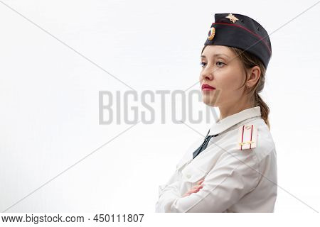 A Beautiful Young Female Russian Police Officer In Dress Uniform In A Cap And Shoulder Straps Of A L