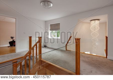 Modern First Floor Landing With Chandelier